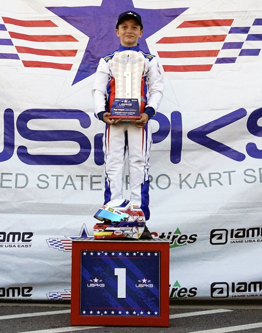 Garcia takes the first place series championship trophy in Mini Swift.